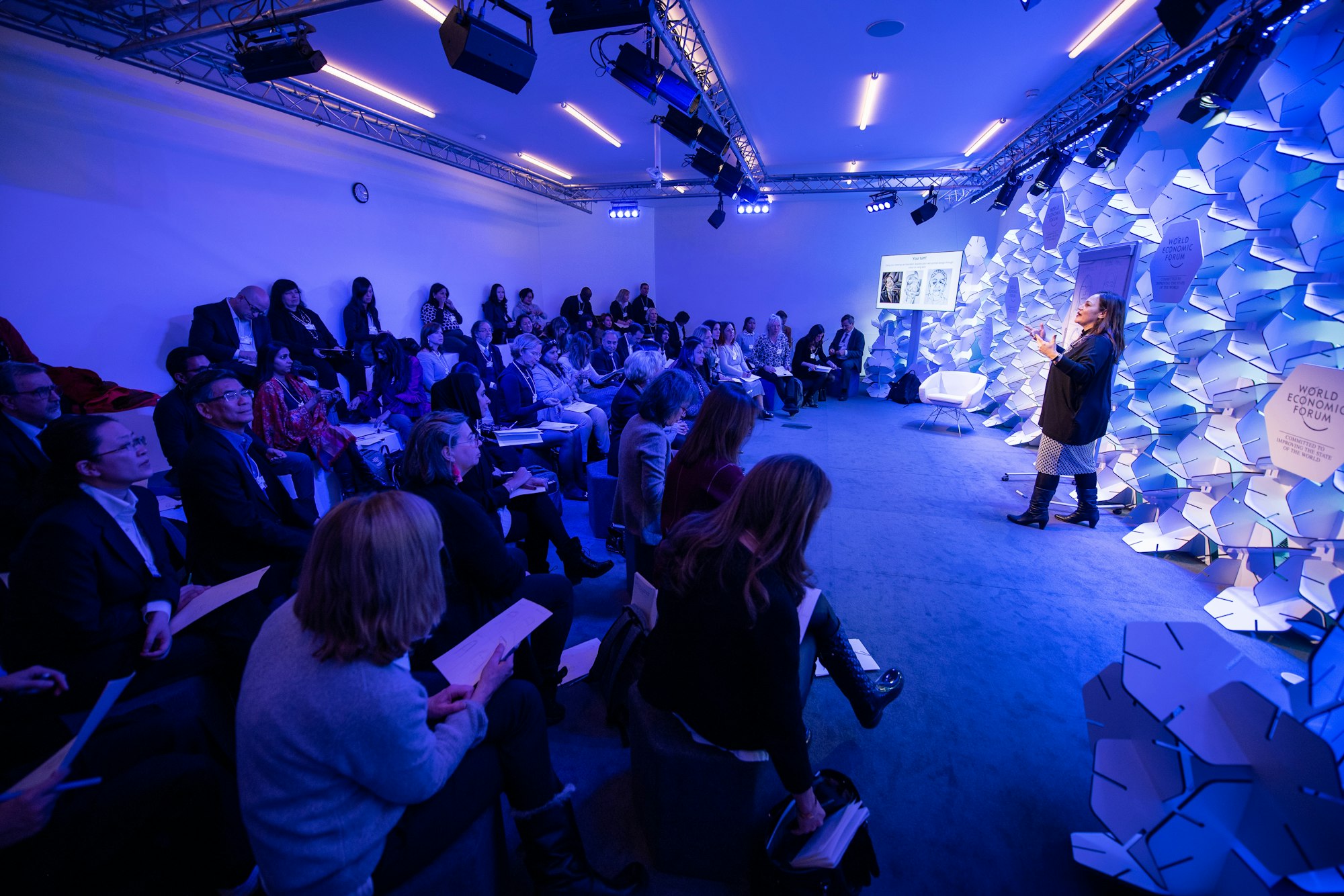 A speaker presenting to delegates at a business conference